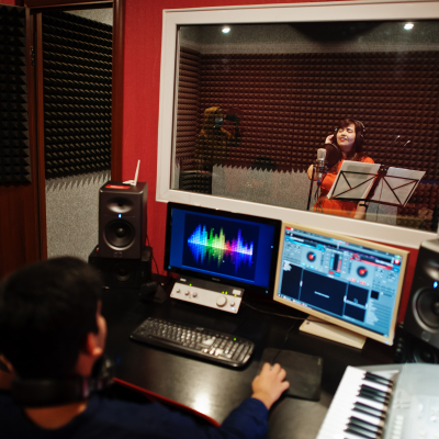 young-asian-singer-with-microphone-recording-song-record-music-studio-with-sound-producer.jpg image 1