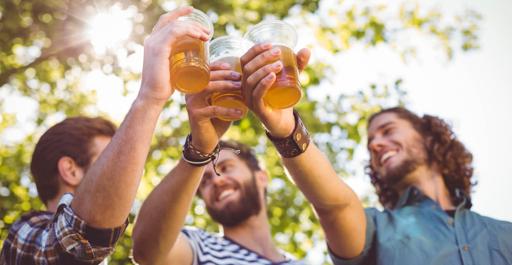 Friends cheering with beers